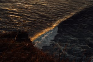 a body of water with waves coming in to shore