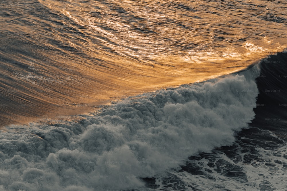 a large wave is coming towards the shore