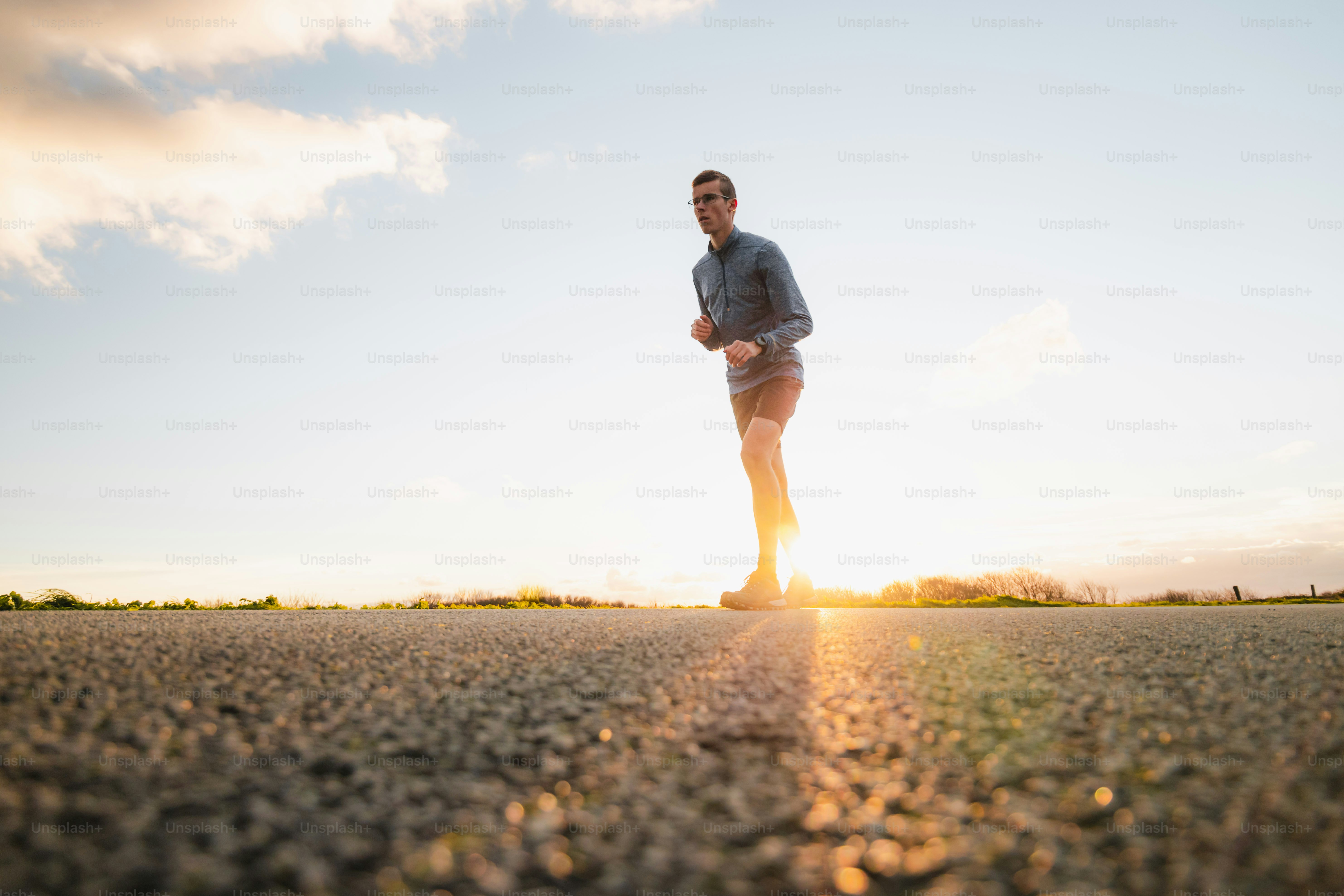a man standing in the middle of a road
