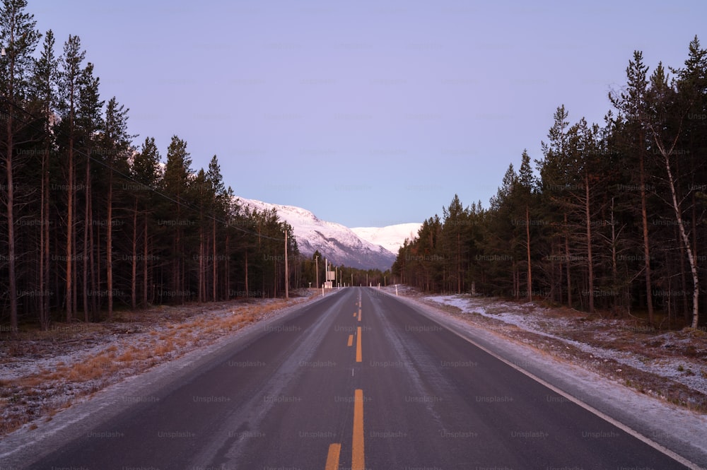 a road with a mountain in the background