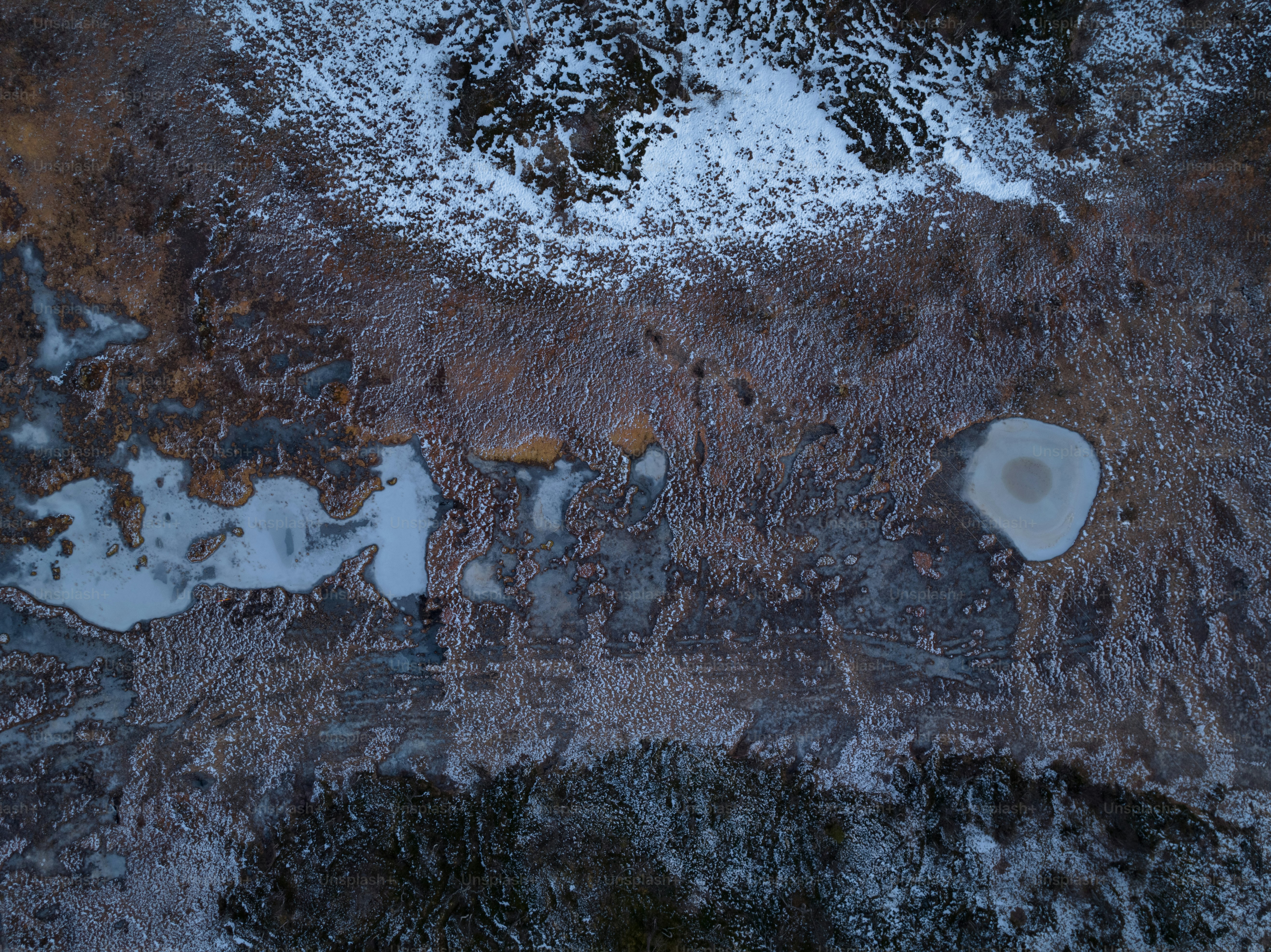 An aerial view of a snow covered field photo – Snowy Image on Unsplash