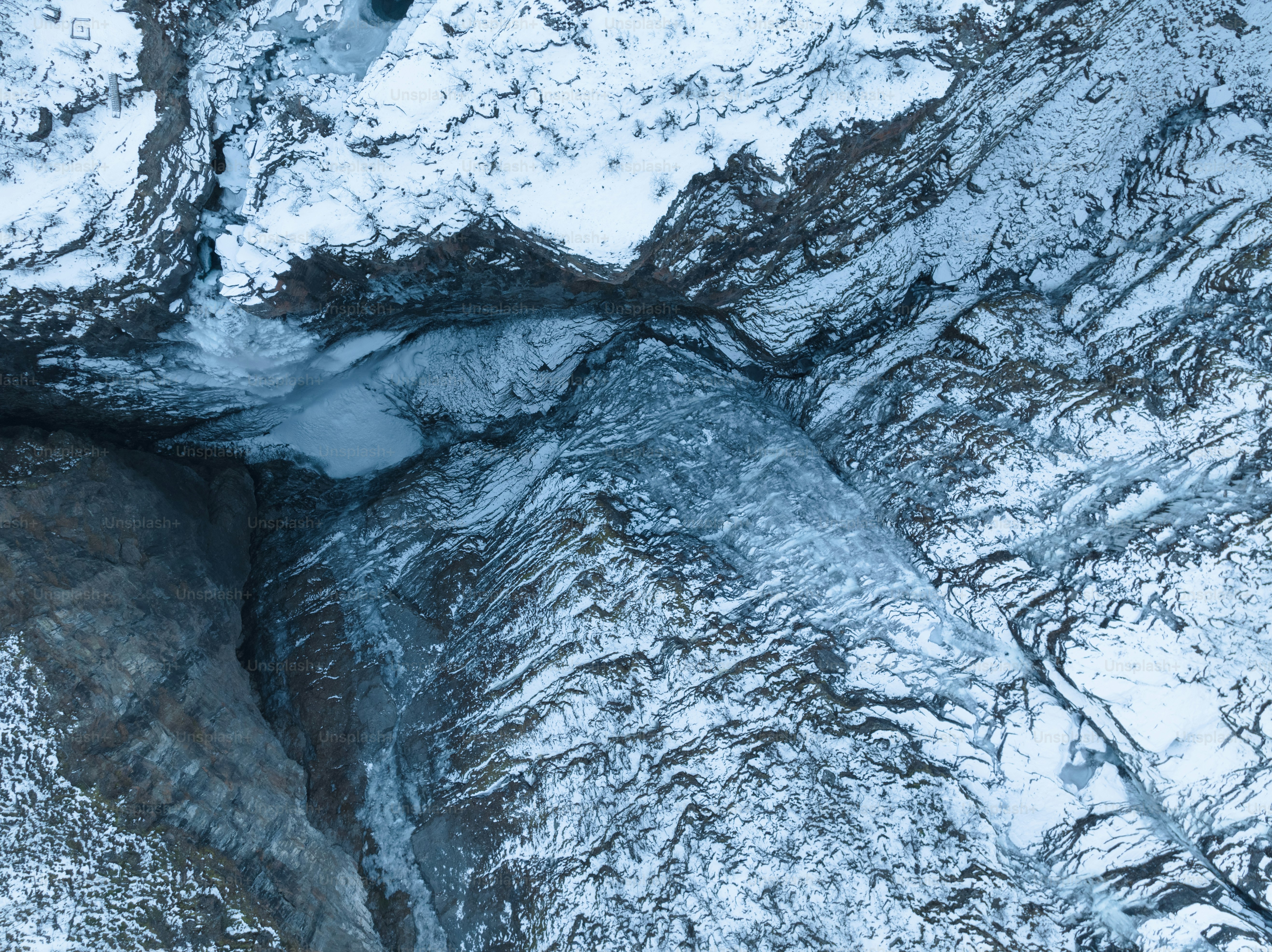 an aerial view of a snow covered mountain