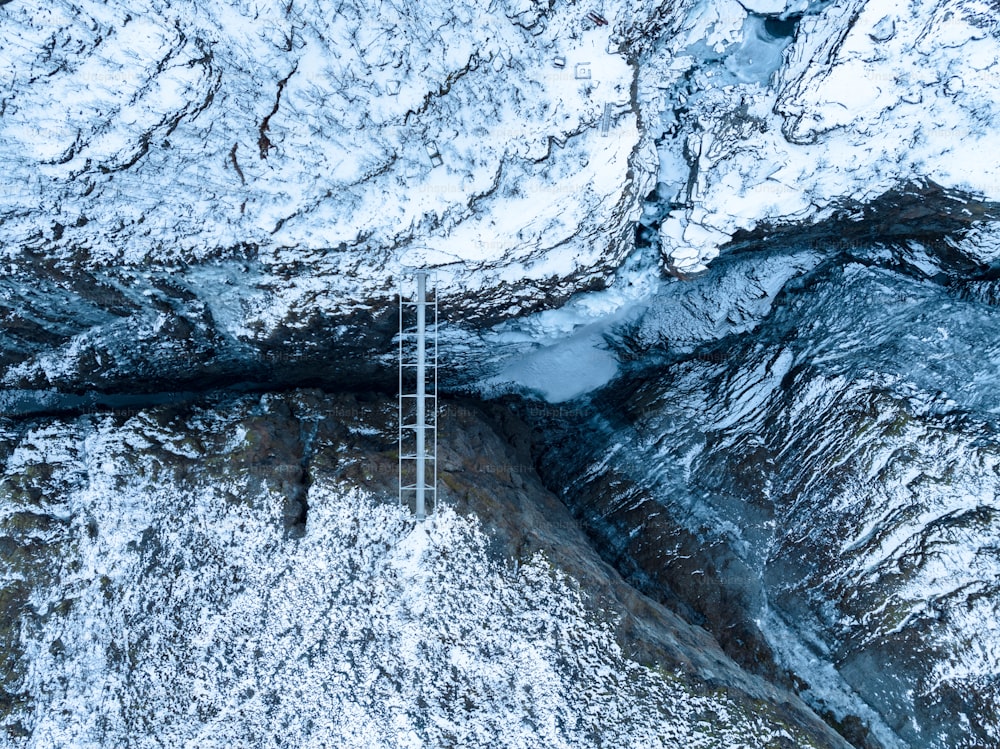 an aerial view of a snow covered mountain