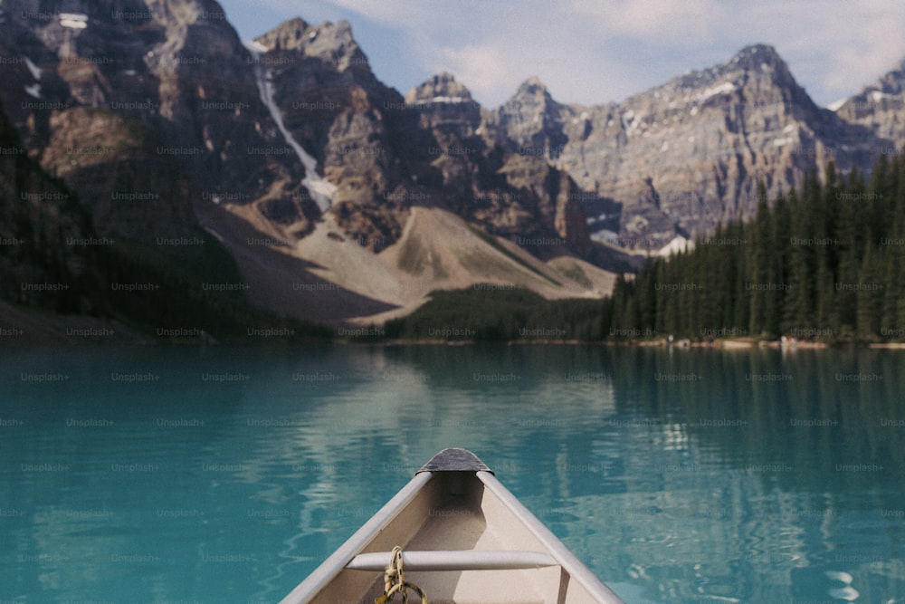 a view of a mountain lake from a canoe