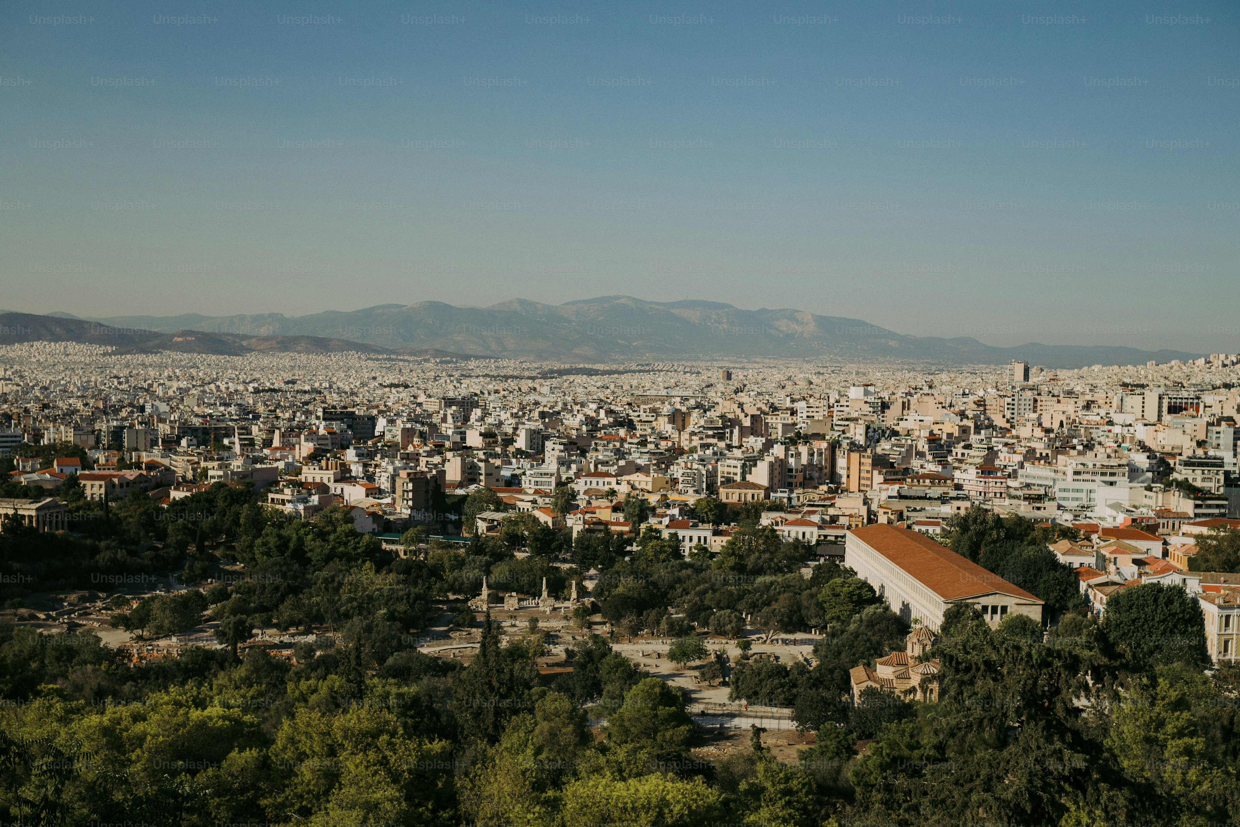 a view of a city with mountains in the background