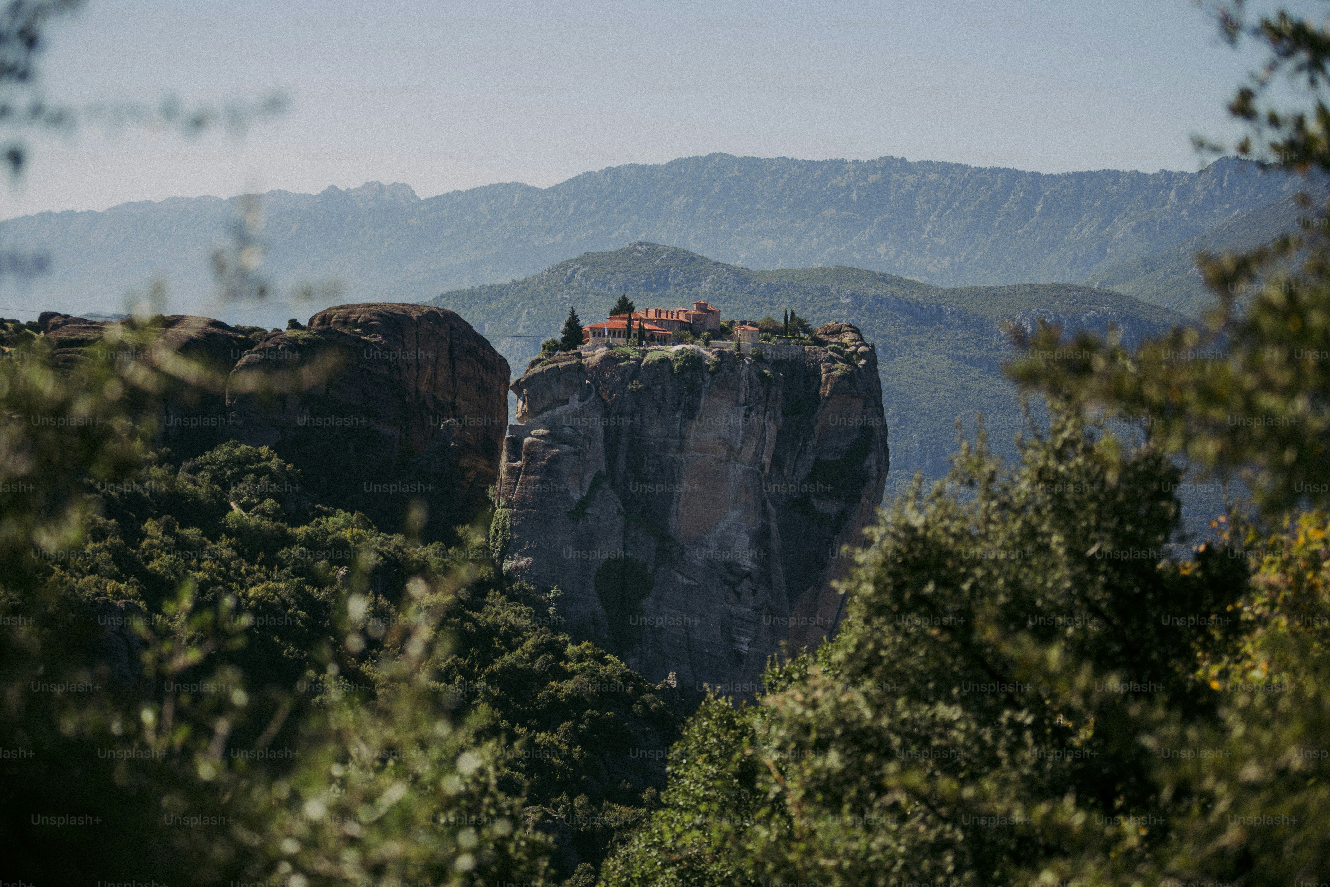 a view of a mountain with a house on top of it