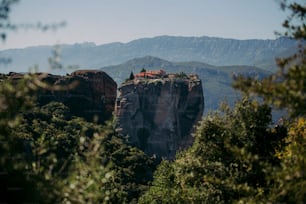 a view of a mountain with a house on top of it