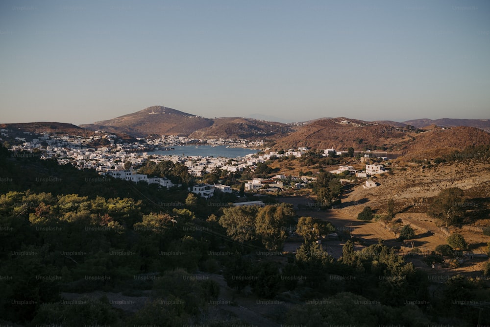 a scenic view of a town and a body of water