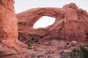 a large rock formation with a hole in the middle of it