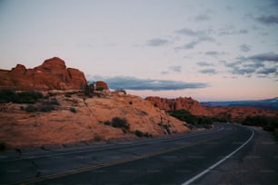 a road with a mountain in the background