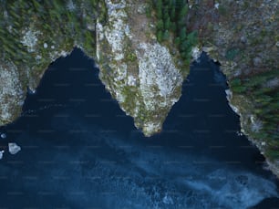 an aerial view of a body of water surrounded by trees