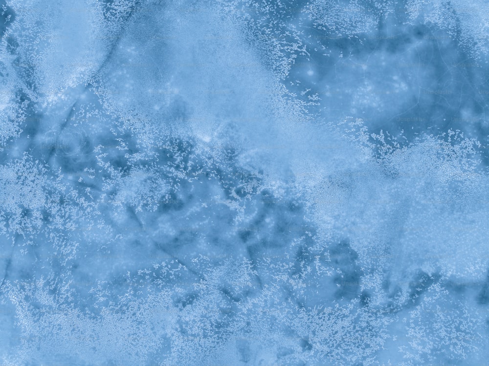 a close up of a blue and white textured background