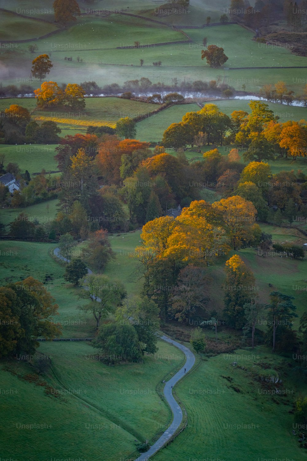 an aerial view of a winding country road