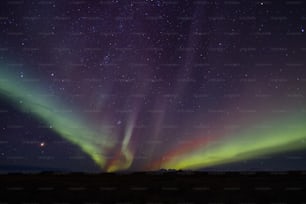 a night sky filled with stars and aurora lights