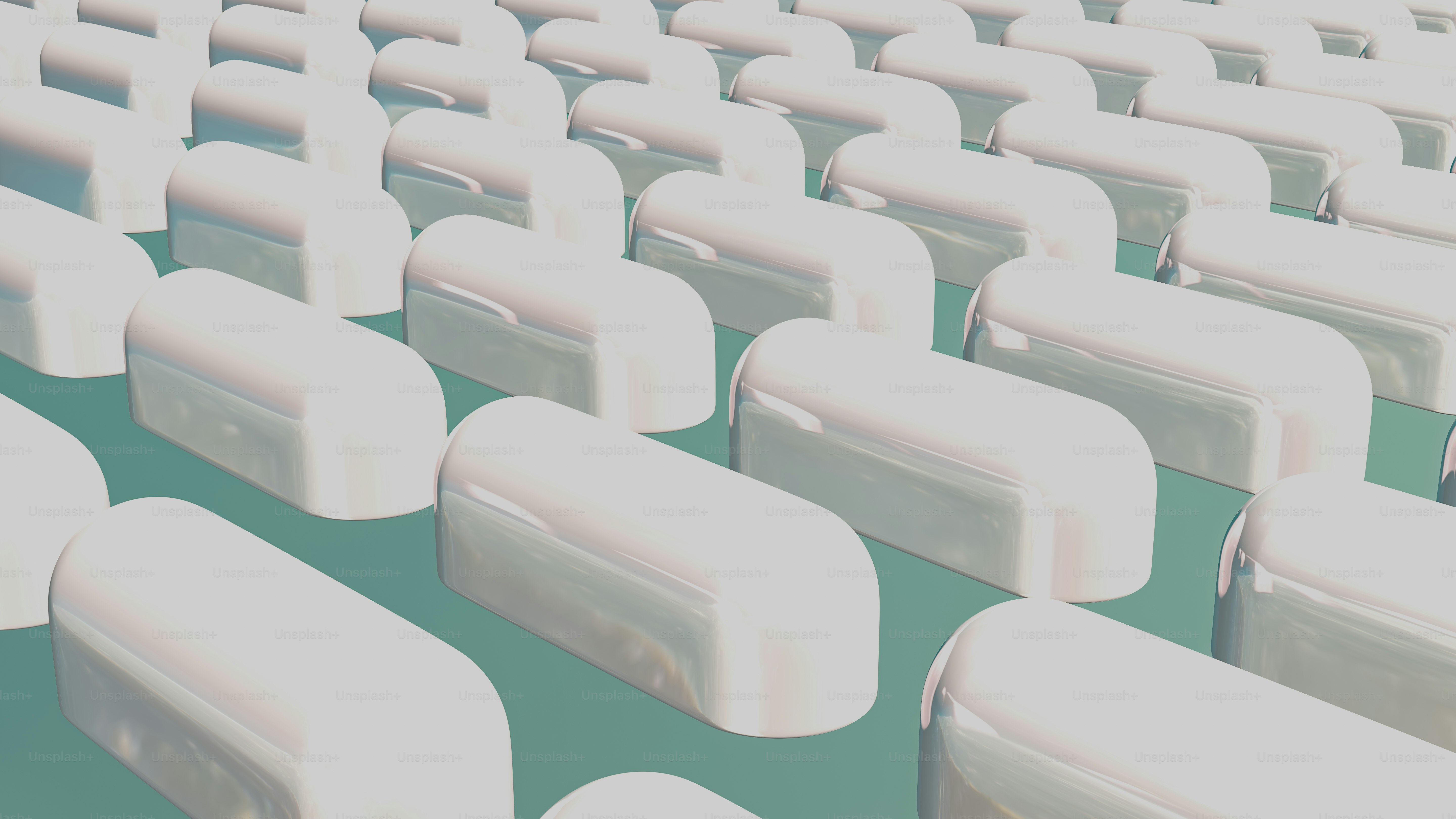 A large group of white plastic objects sitting on top of a green ...