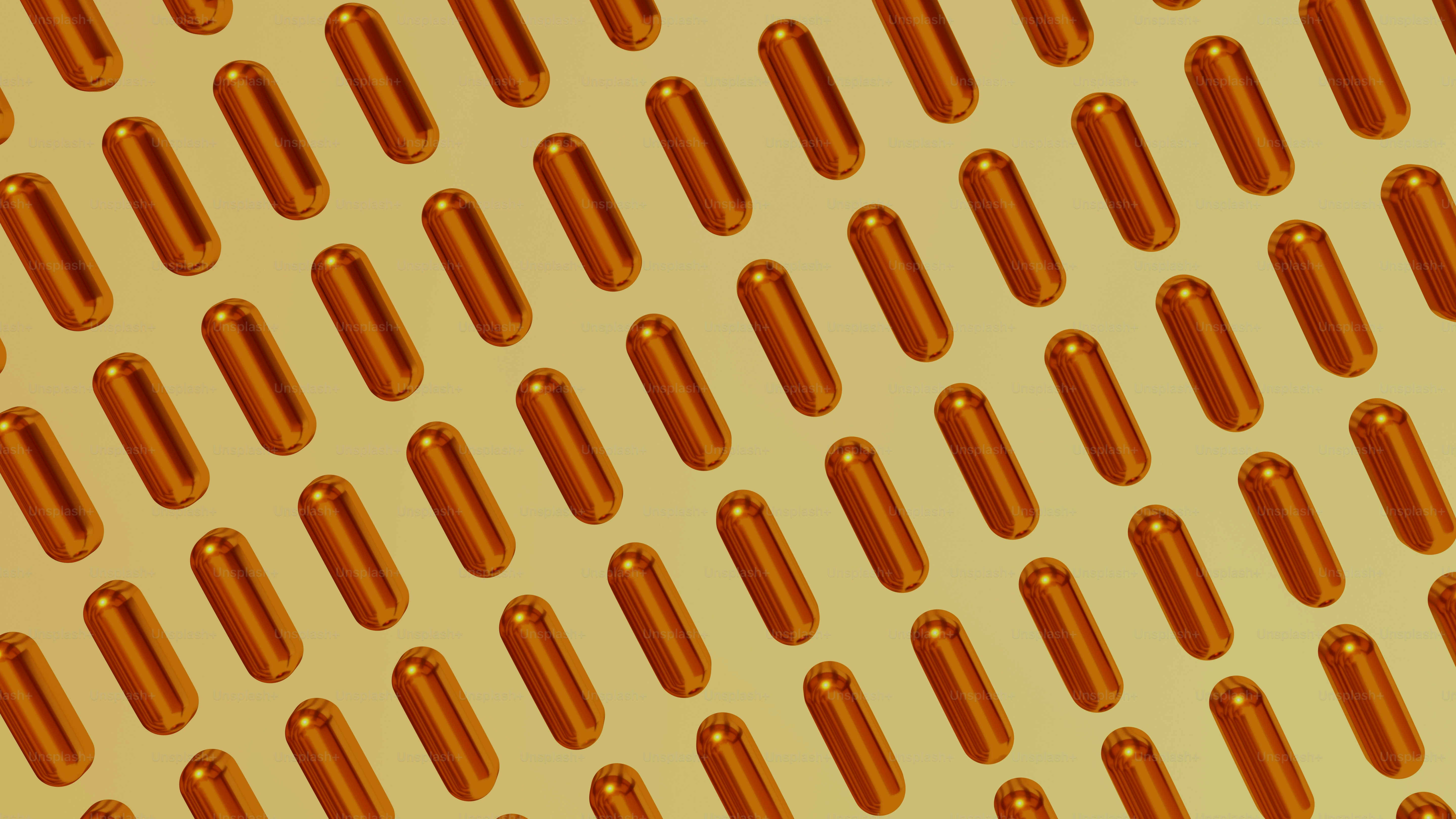 a yellow background with rows of orange pills