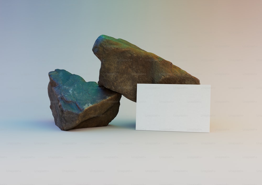 a rock with a blank card next to it