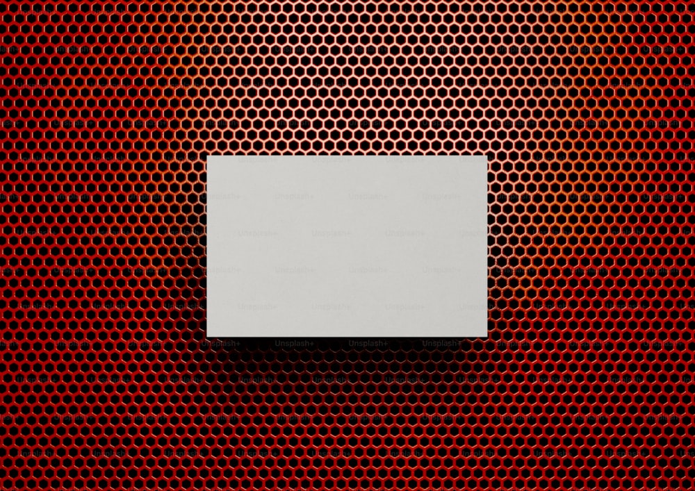 a white box sitting on top of a red background