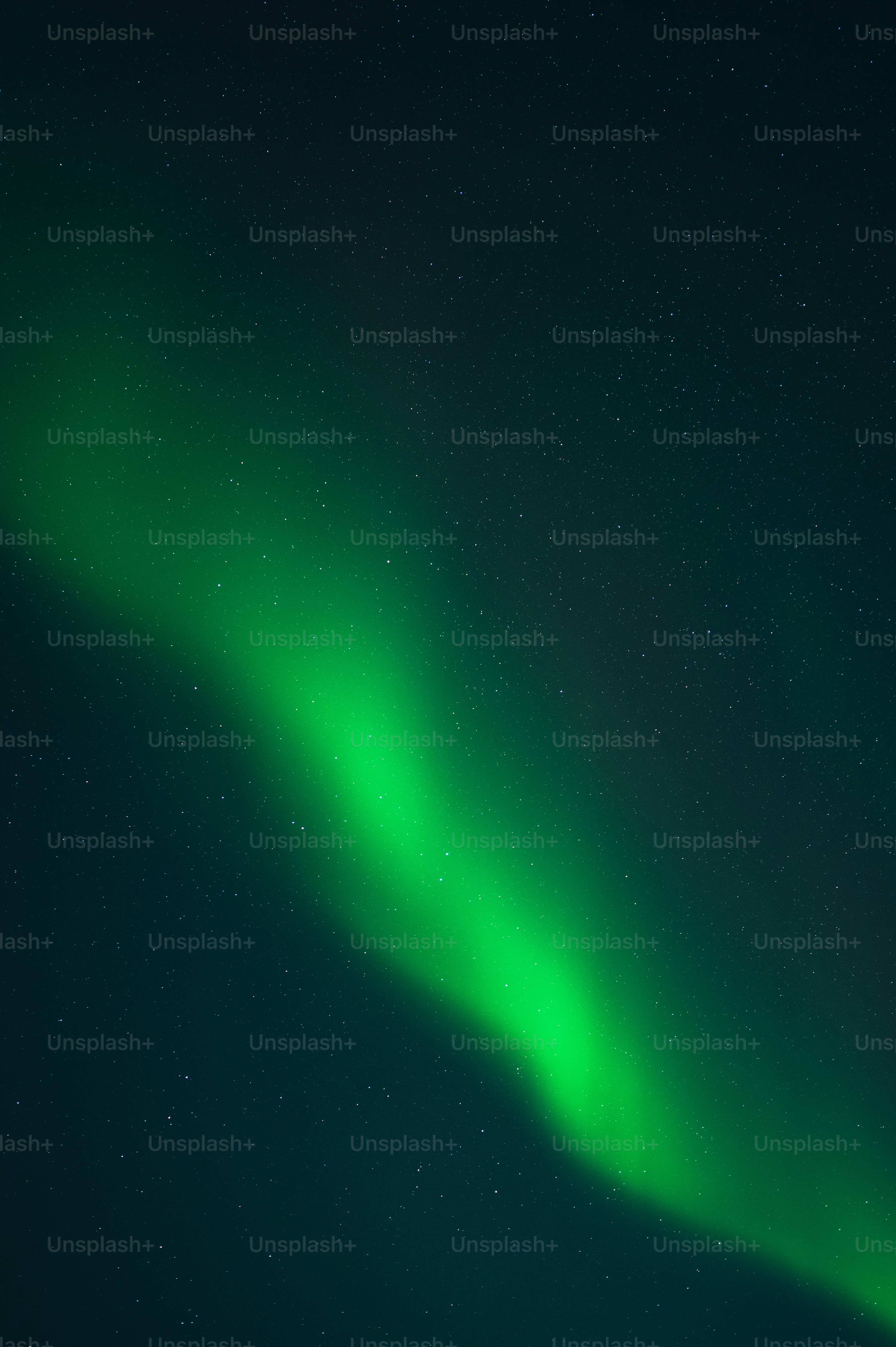 a bright green aurora bore in the night sky