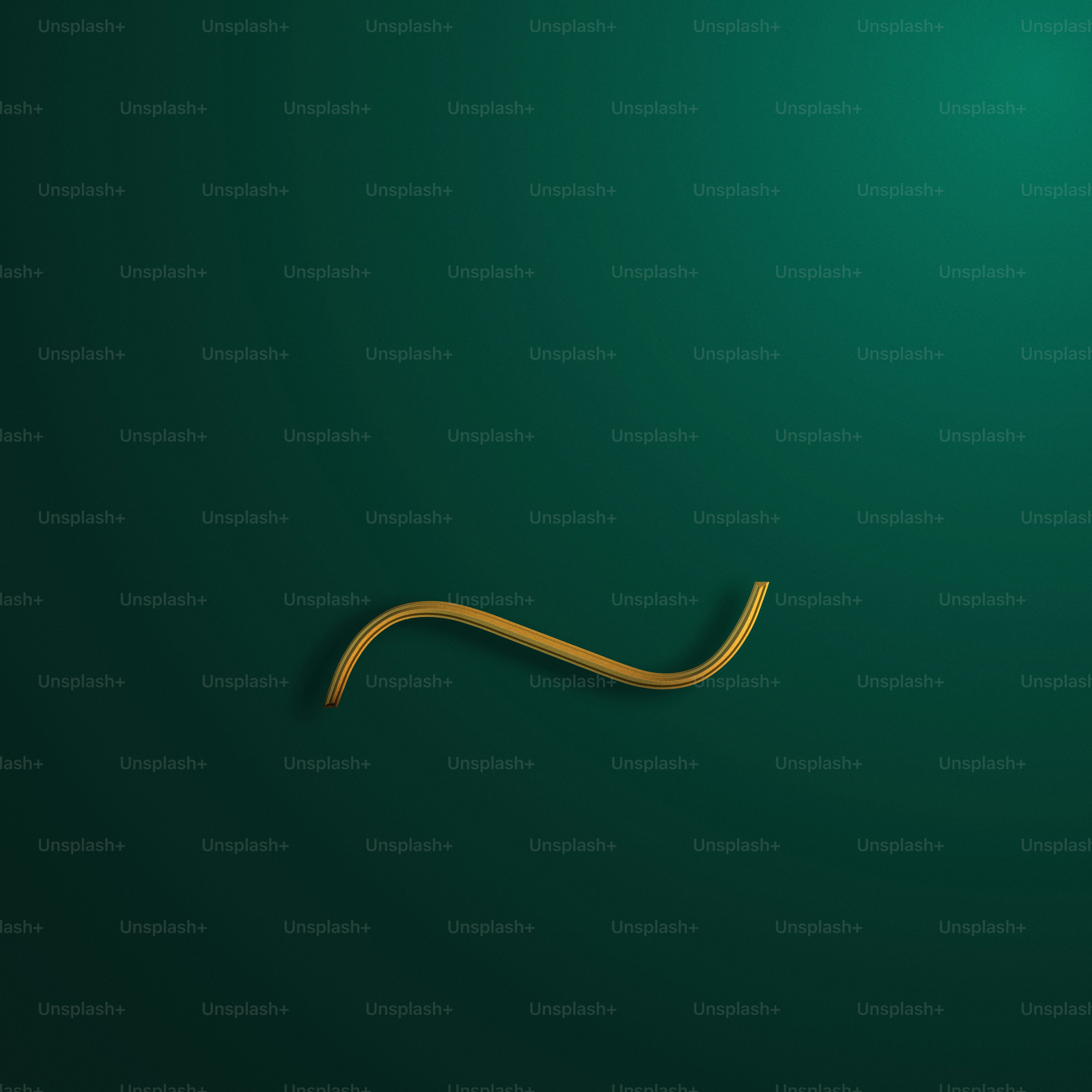 a green wall with a gold curved object on it