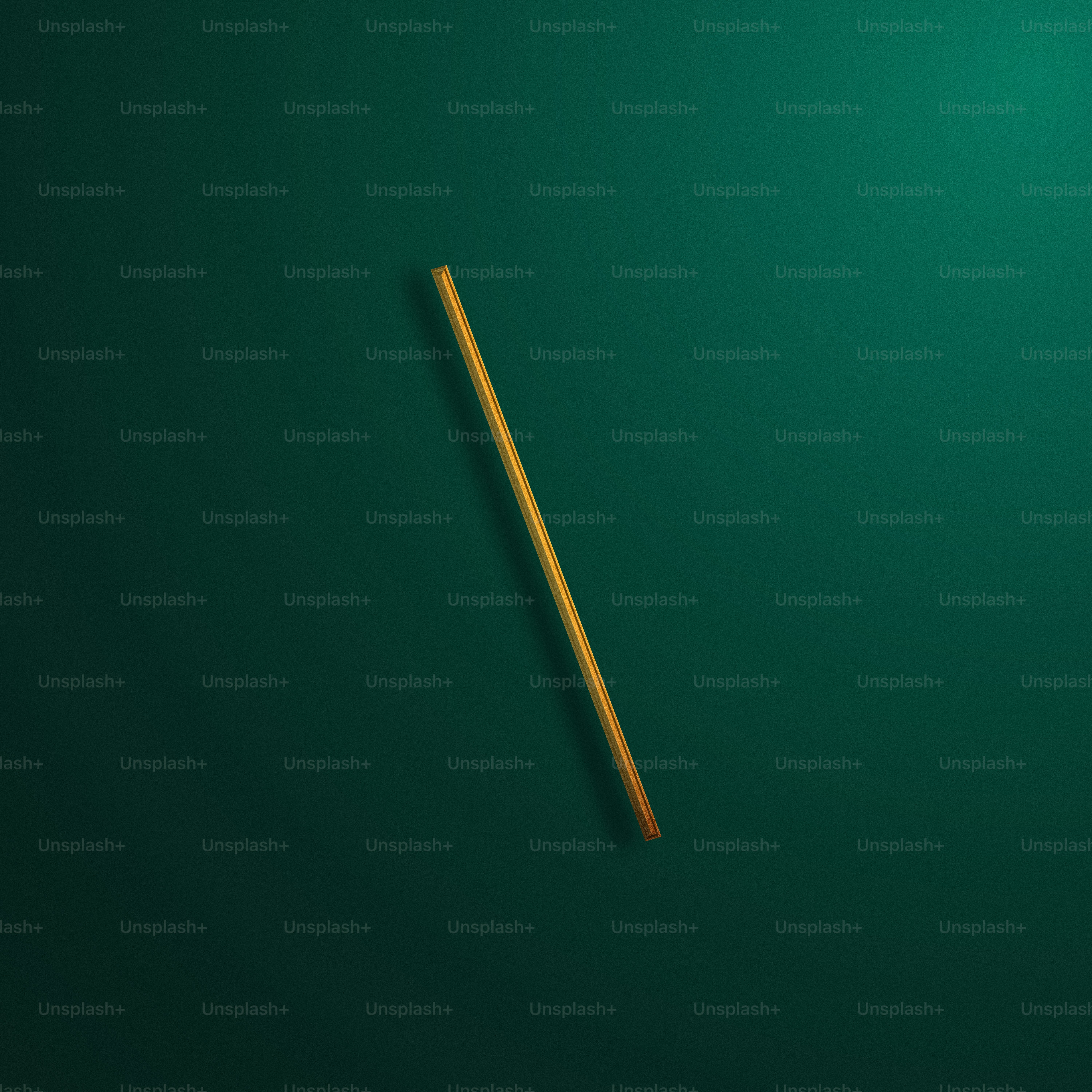 a wooden stick laying on a green surface