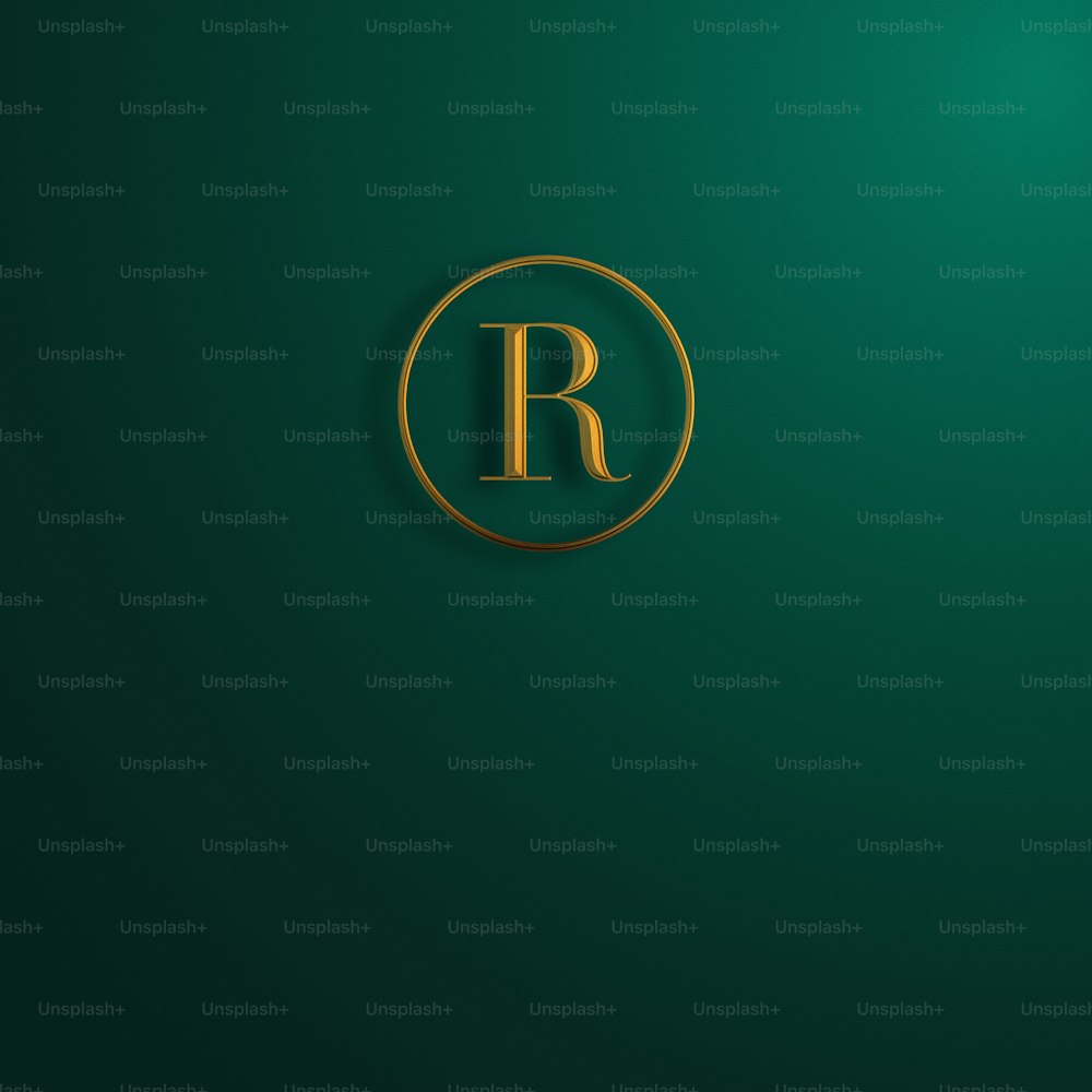 the letter r in a gold circle on a green background