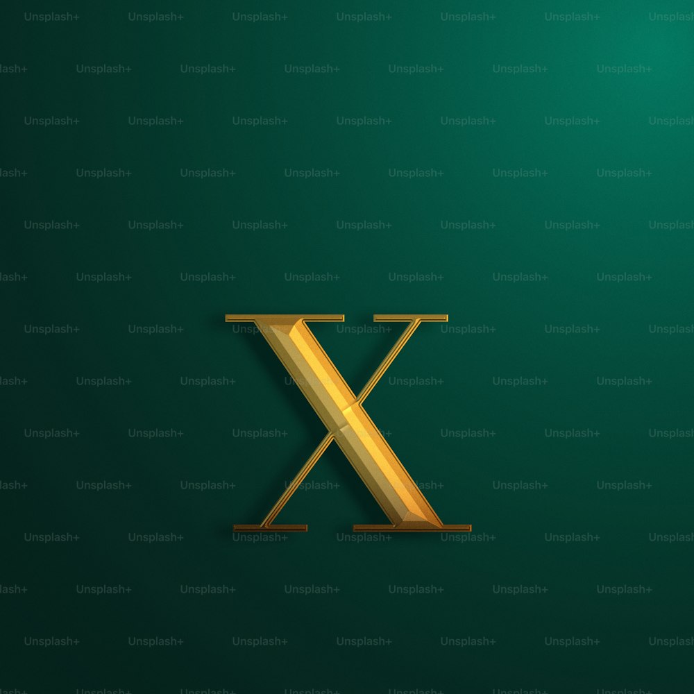 a gold letter x on a green background