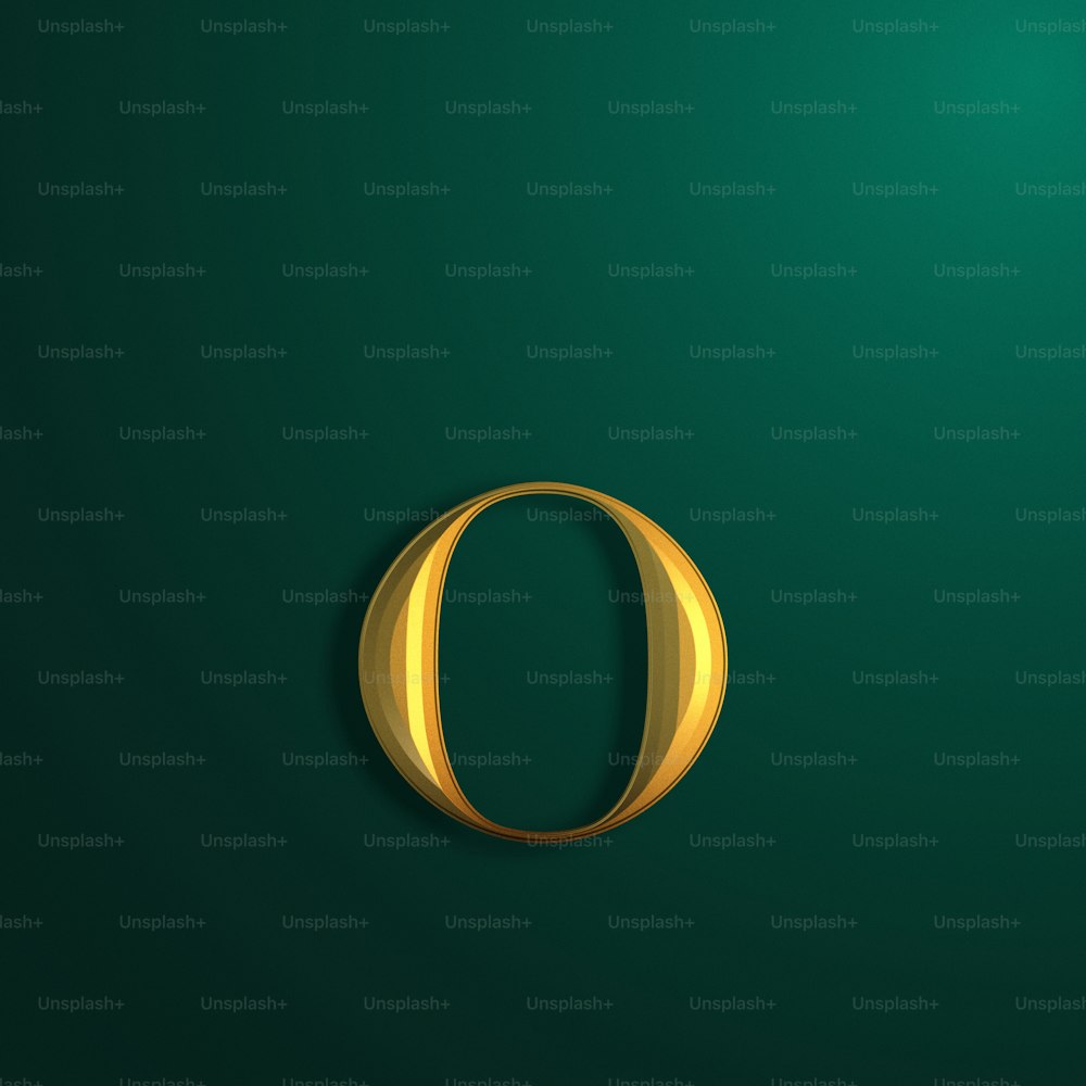 a gold letter o on a green background