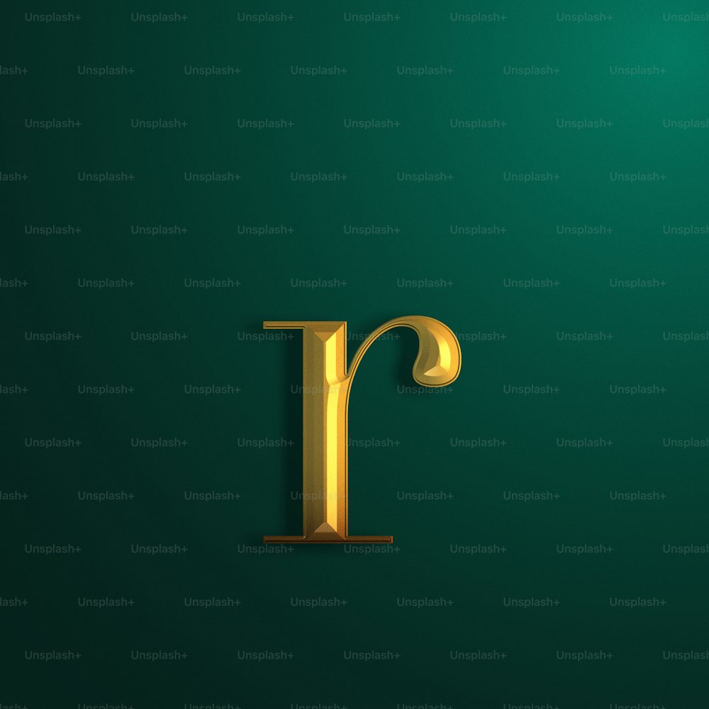 a gold letter on a green background