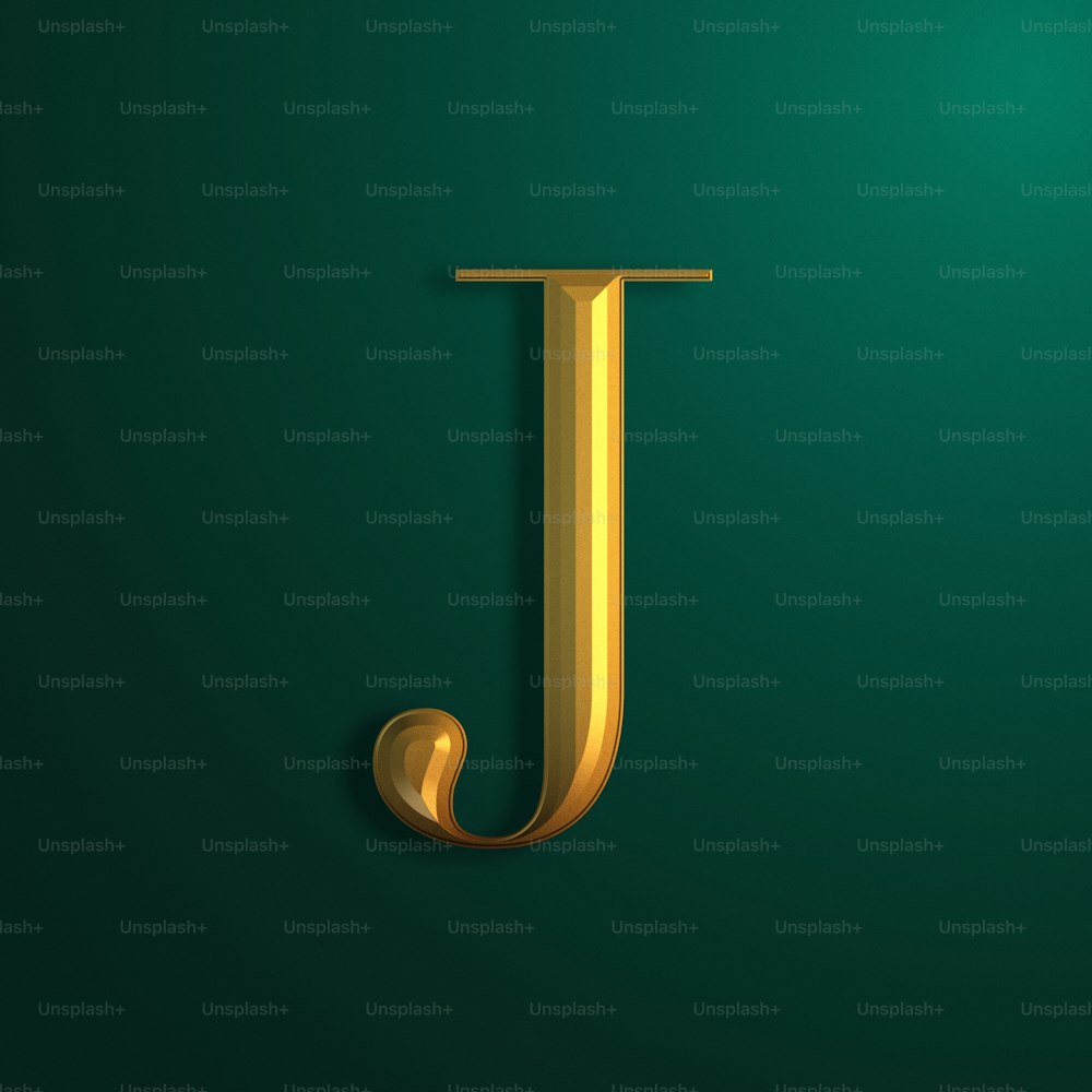 a gold letter j on a green background