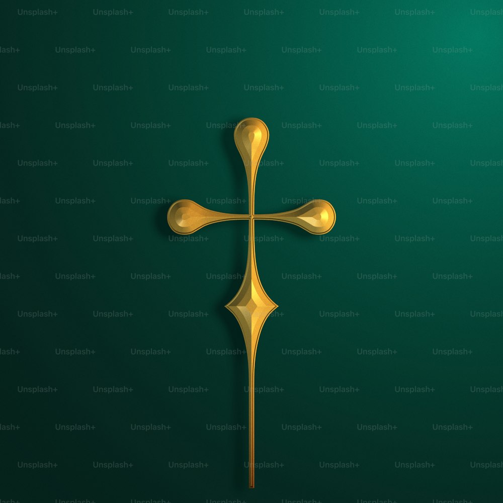 a gold cross on a green background