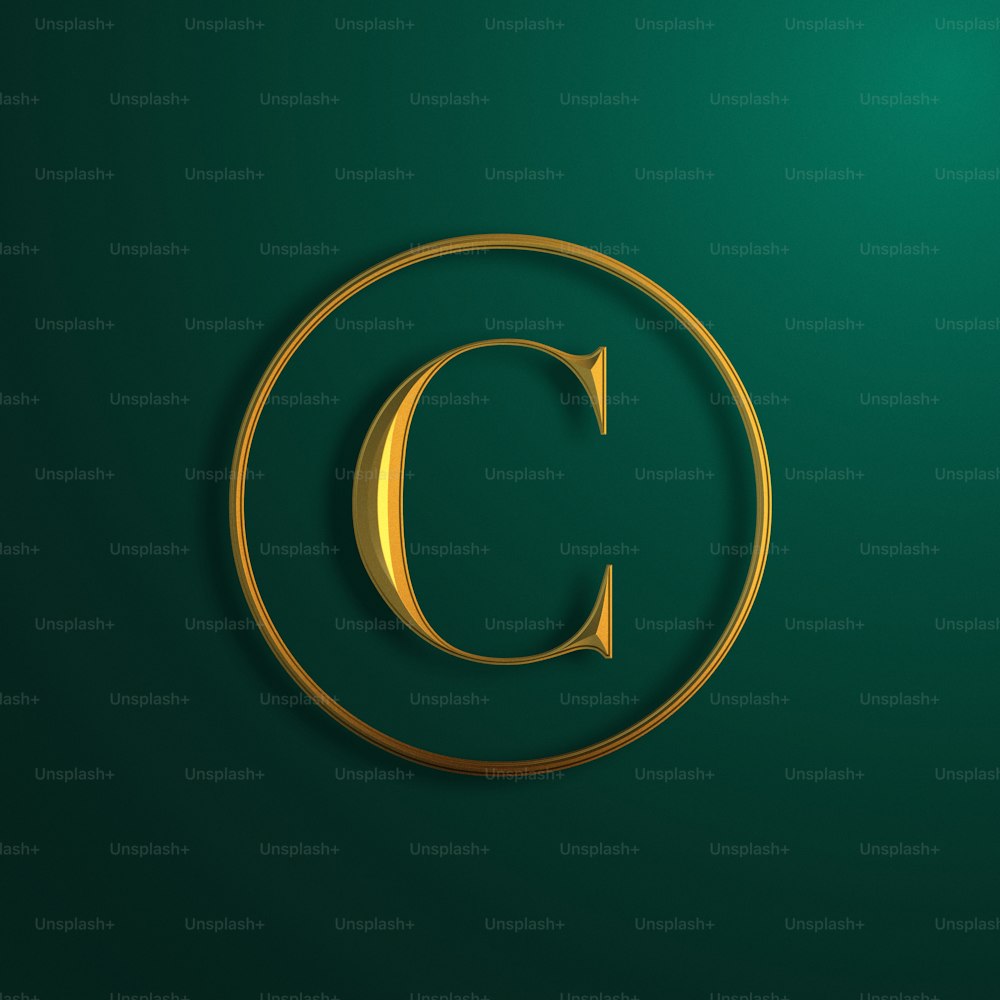 the letter c in a golden circle on a green background
