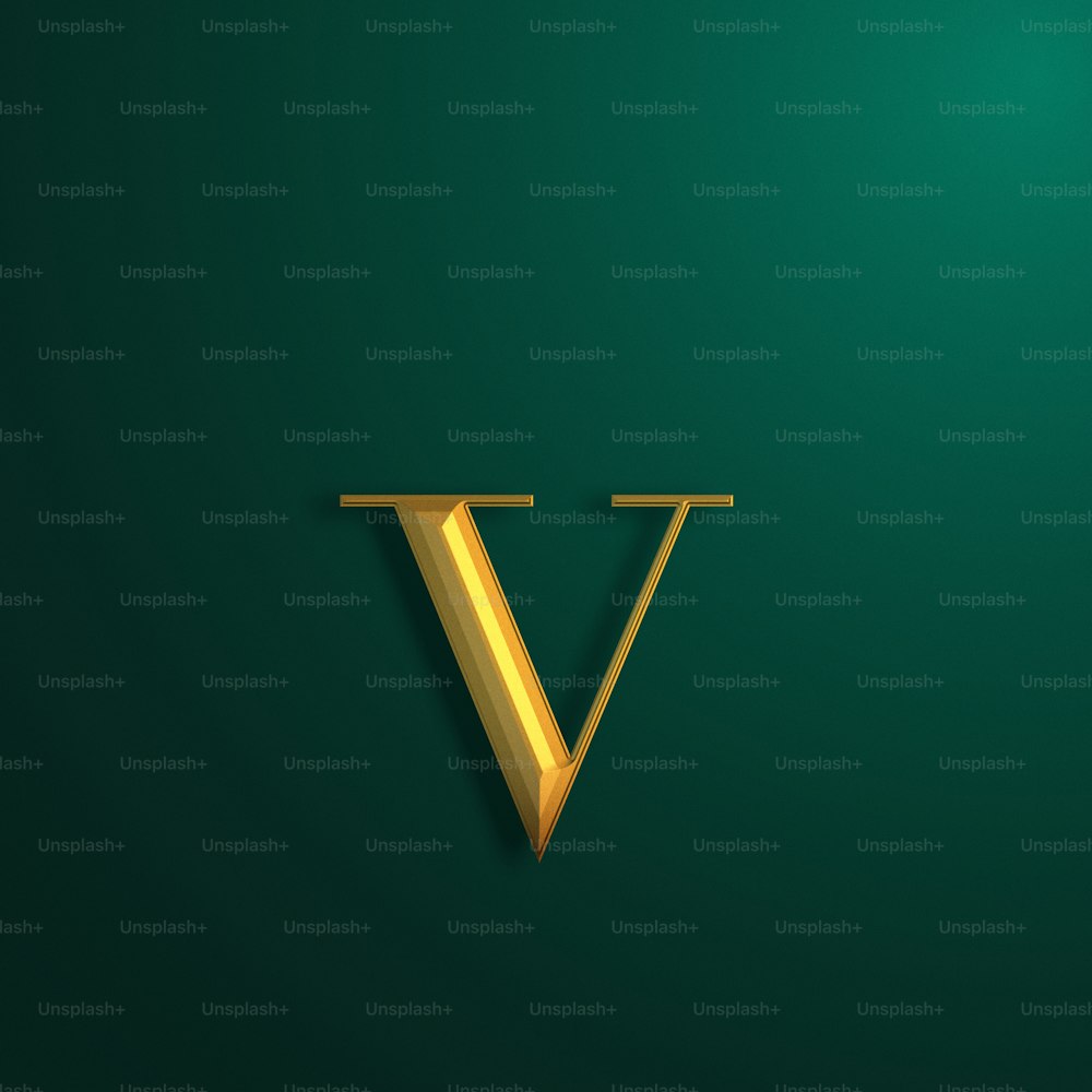 a gold letter v on a green background