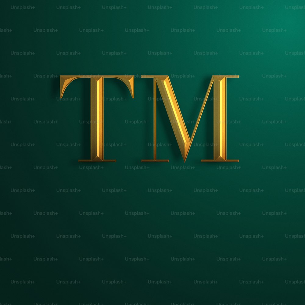 the letter tm is made up of gold letters