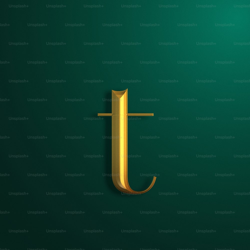 a gold letter j on a green background