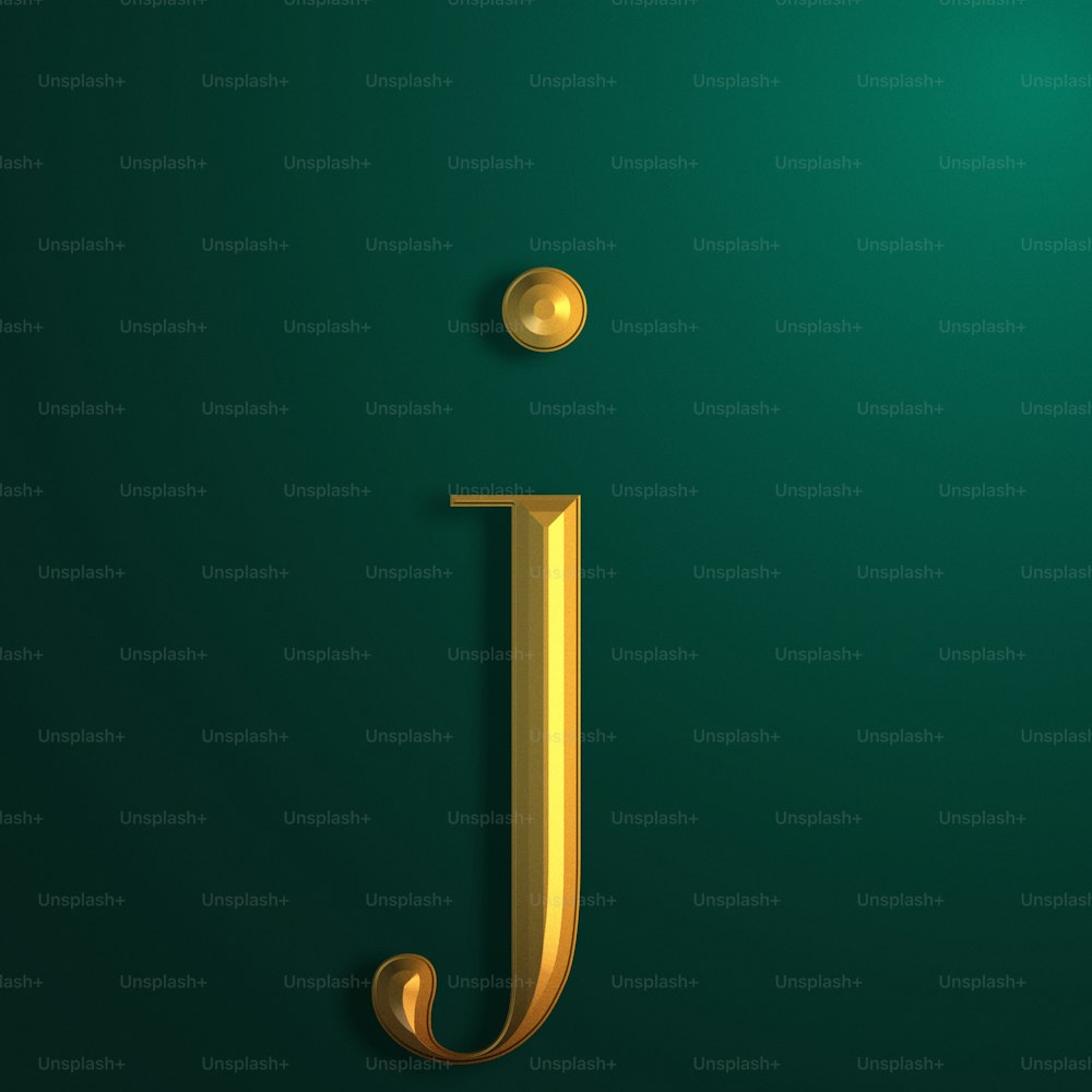 a gold letter j on a green background