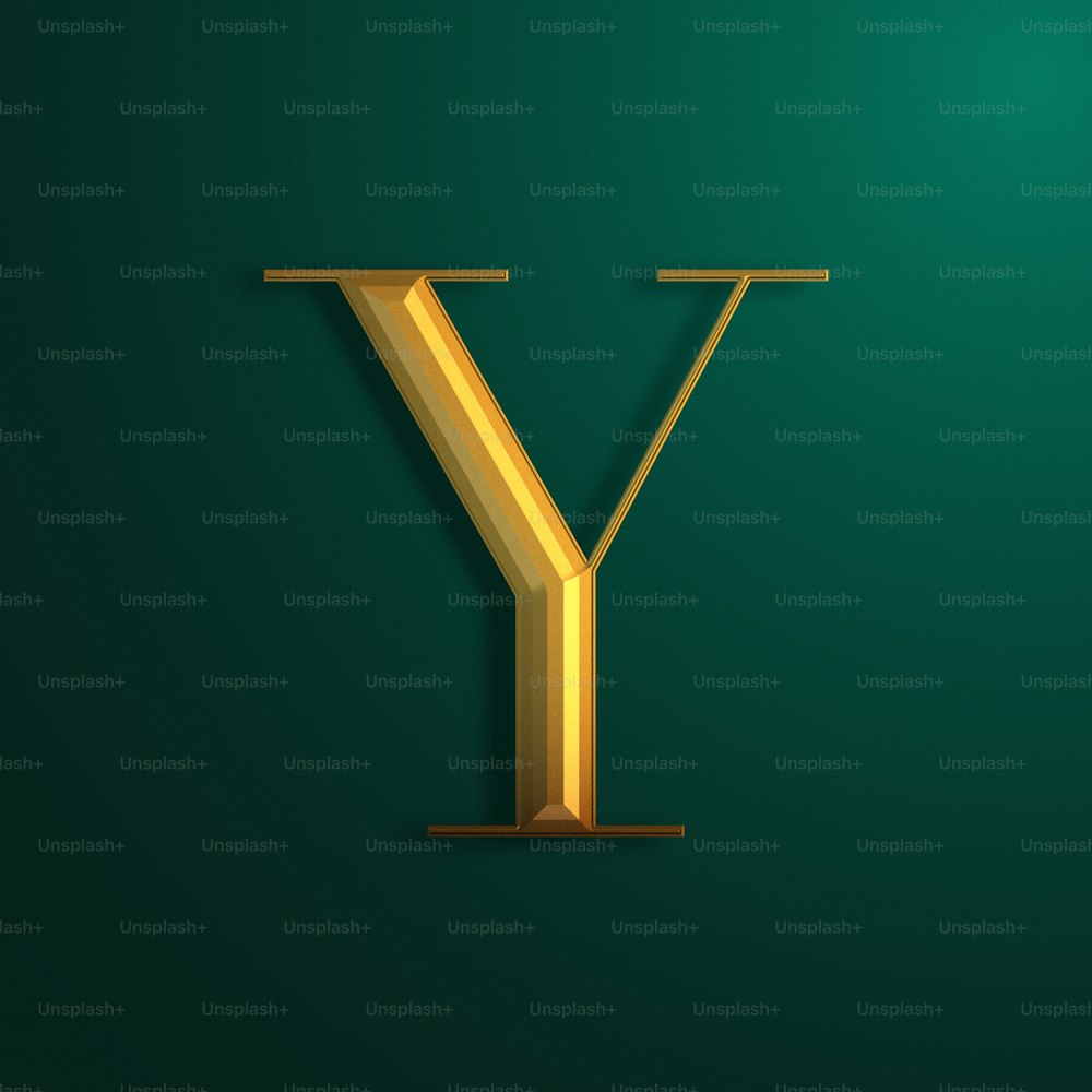 a golden letter y on a green background