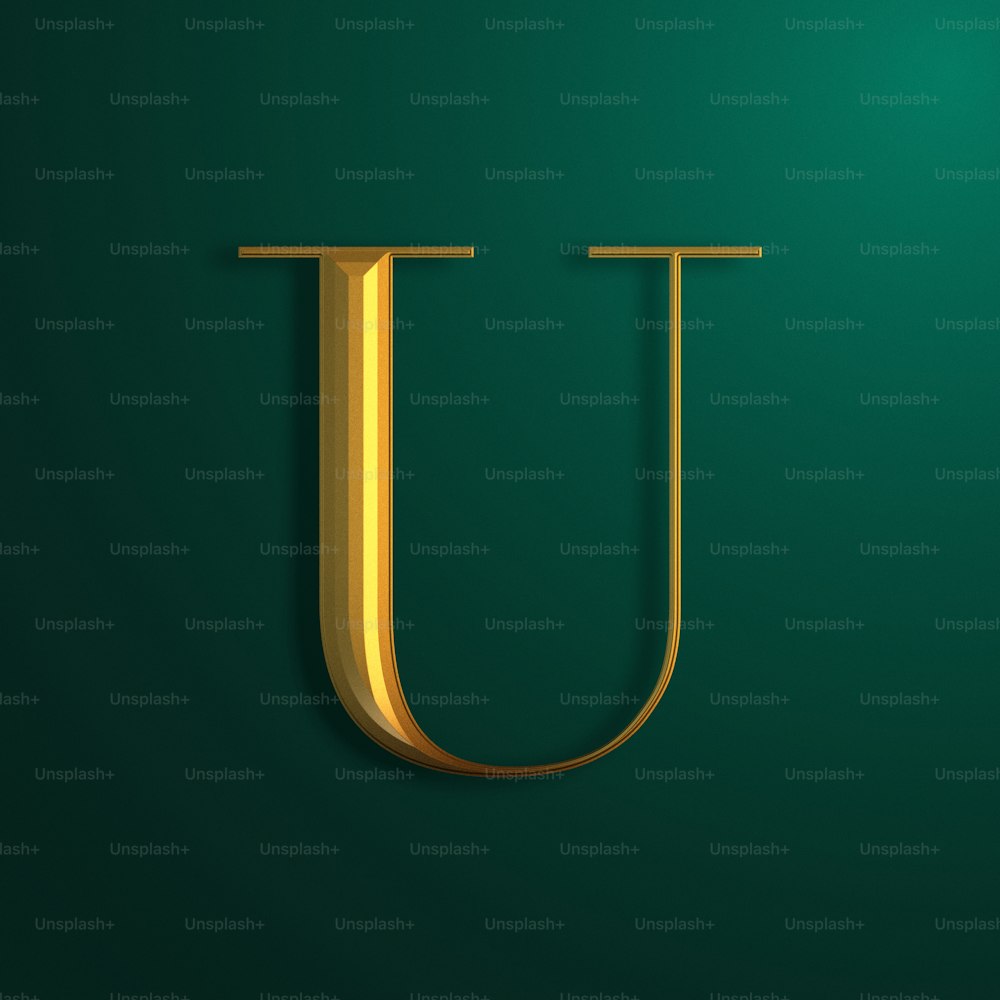 緑の背景に金色の文字 U