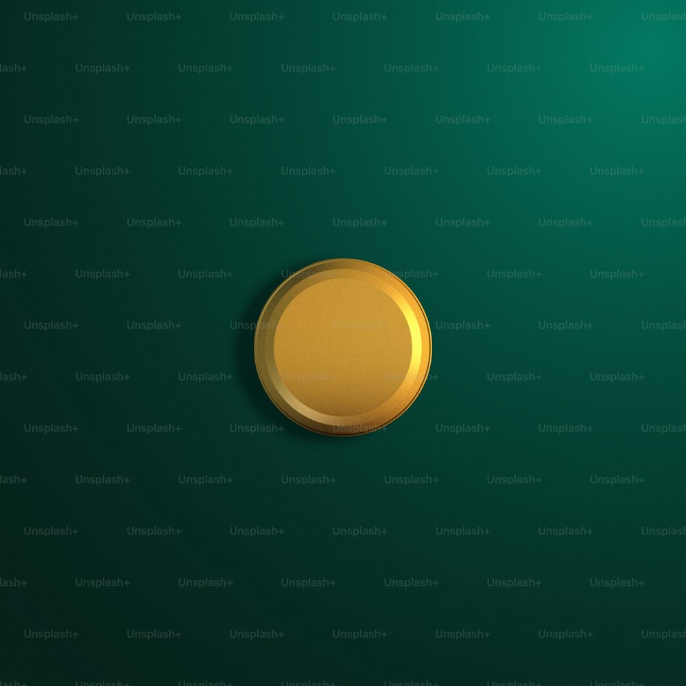 a gold button on a green background