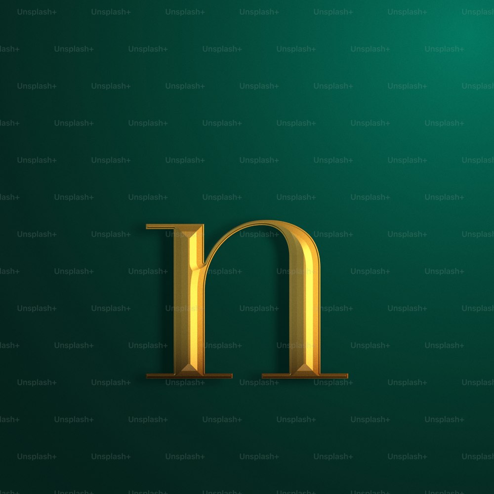 a gold letter m on a green background