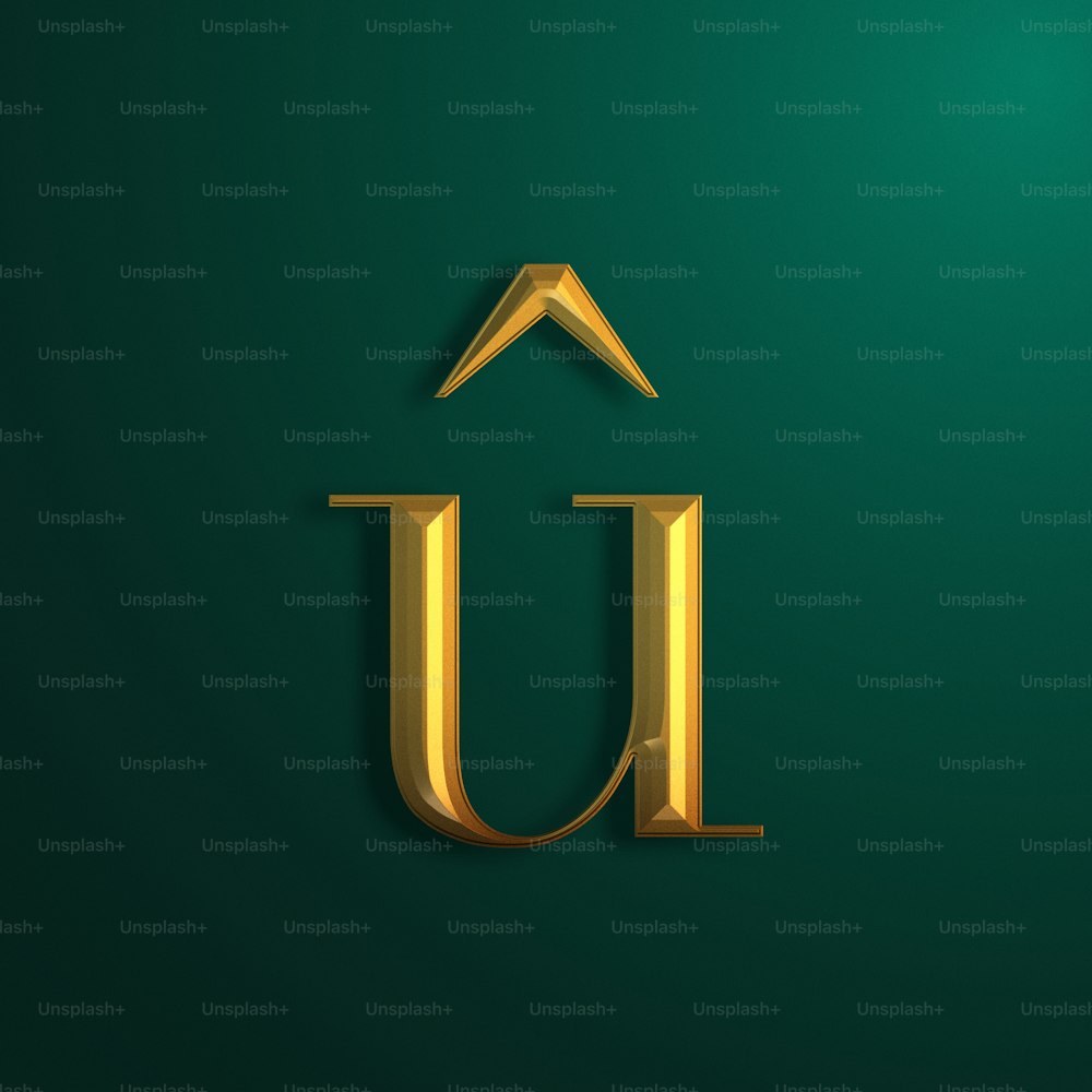 La lettera U in oro su sfondo verde