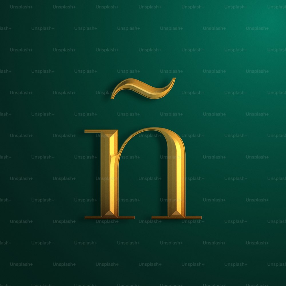 a gold letter on a green background