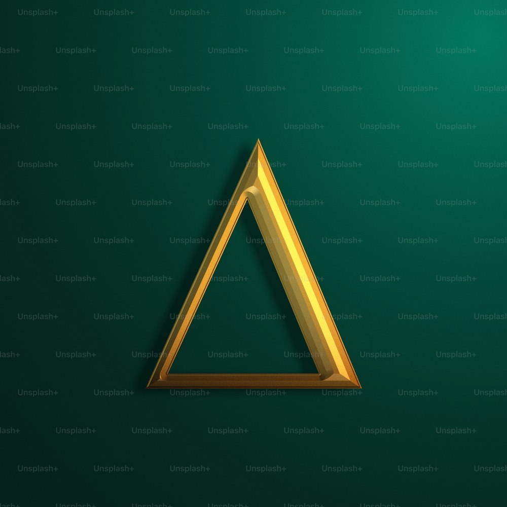 a gold triangle on a green background