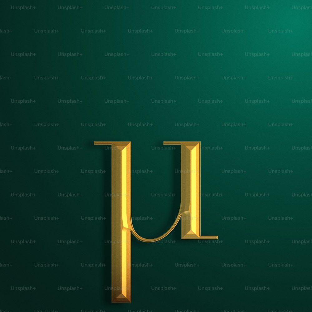 a gold letter u on a green background