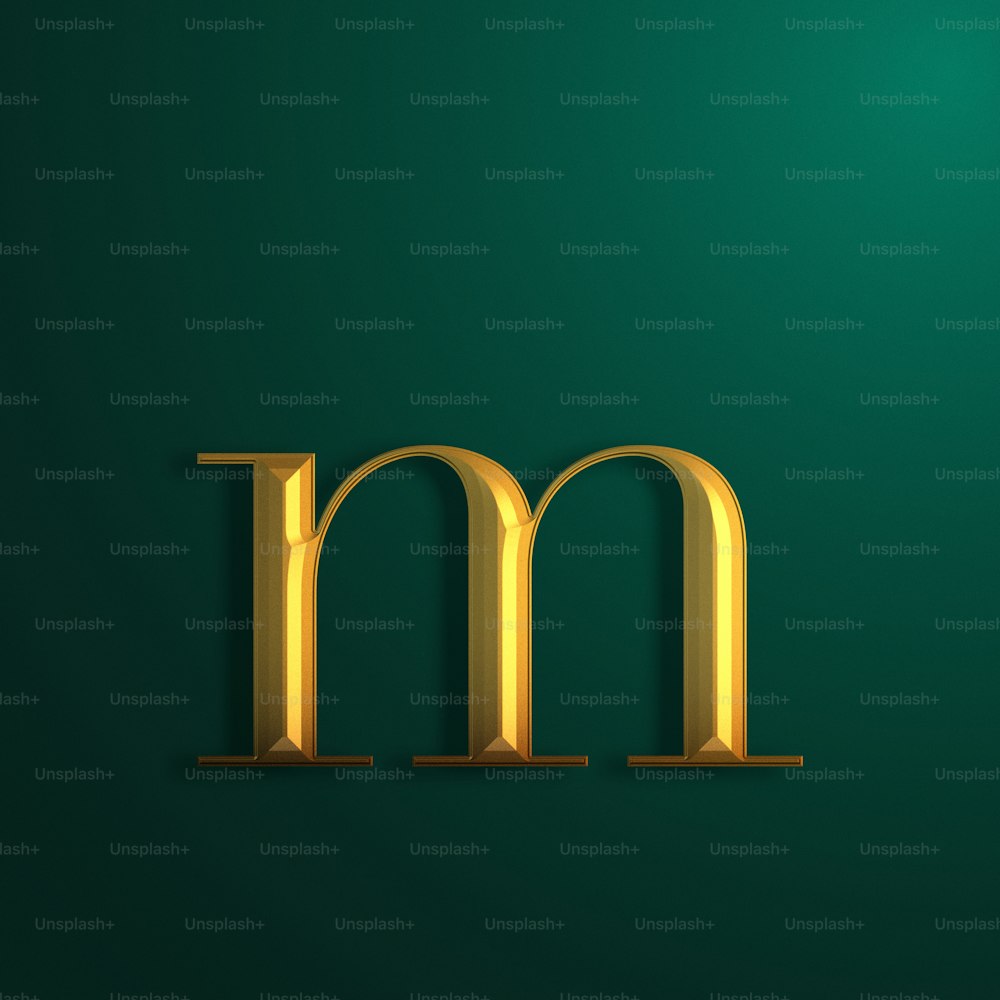 uma letra de ouro m em um fundo verde