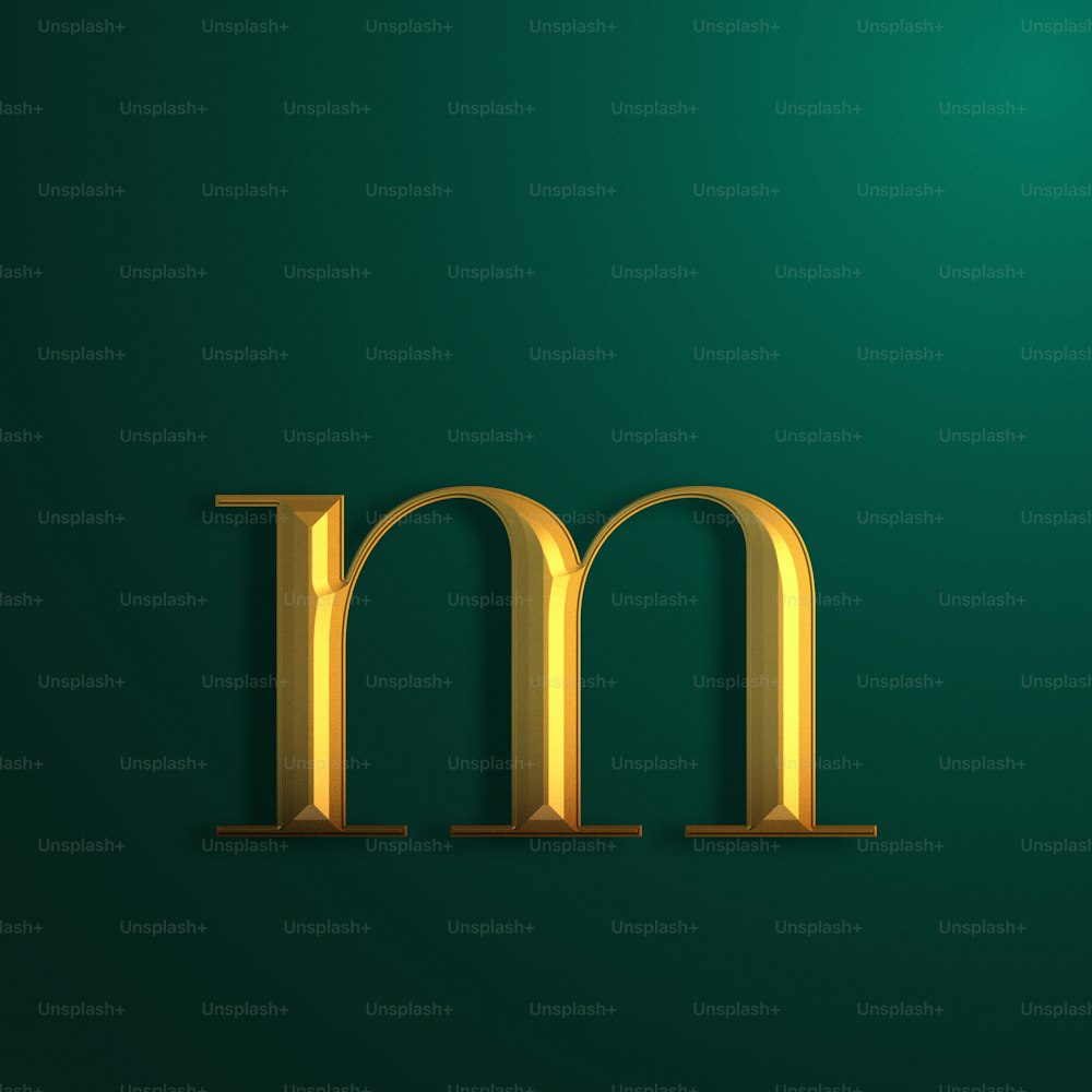 a gold letter m on a green background