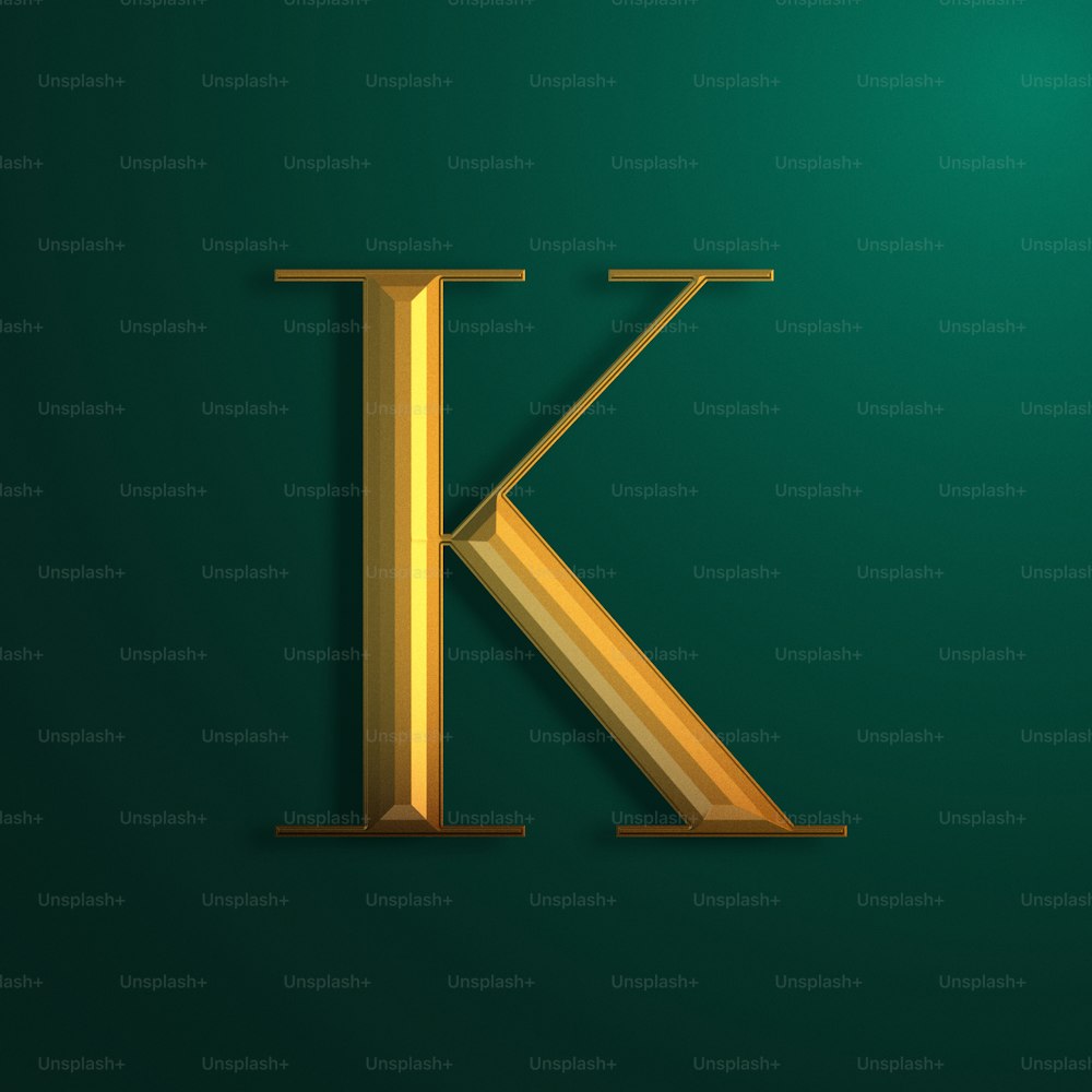 a golden letter k on a green background