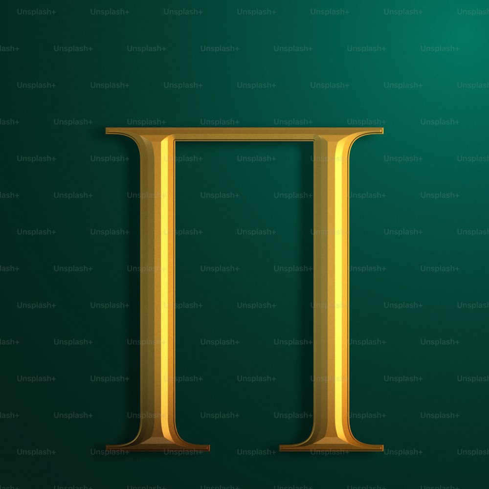 a golden letter that is on a green background