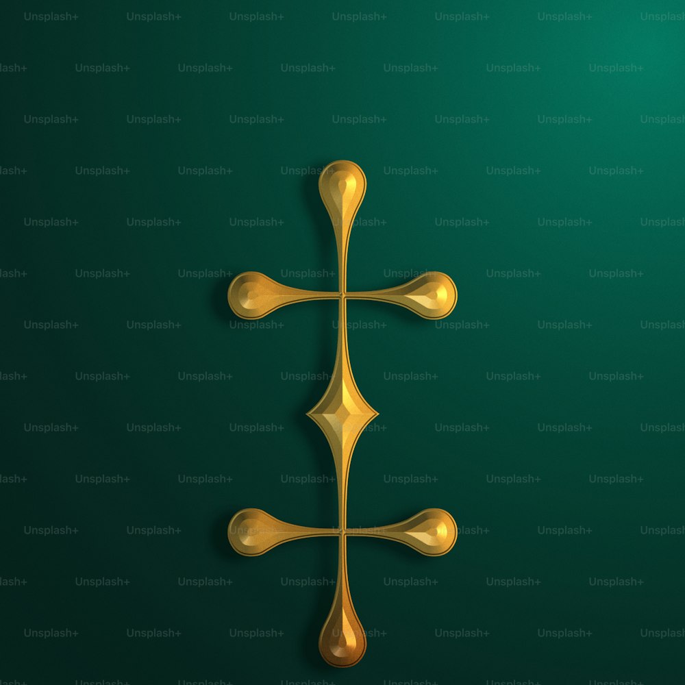 a gold cross on a green background