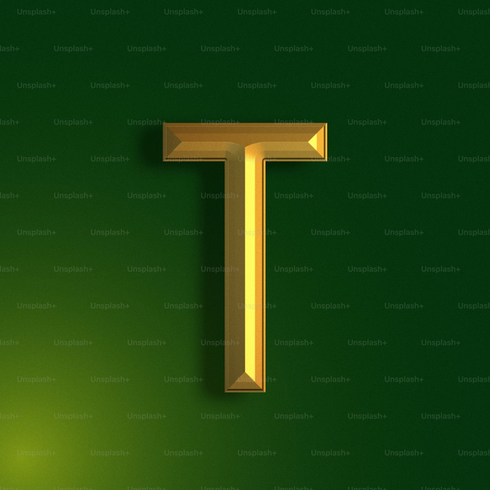 a gold letter t on a green background